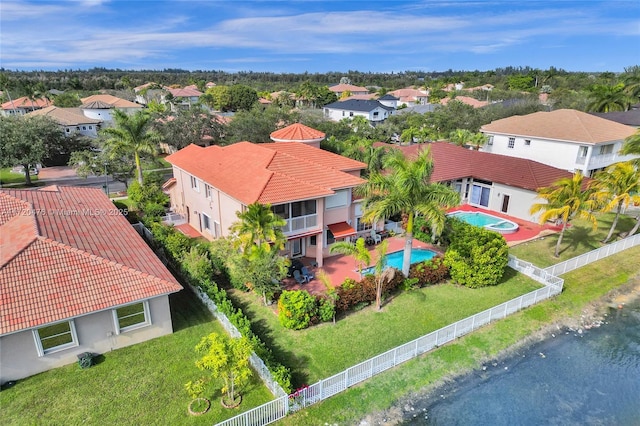 birds eye view of property with a water view