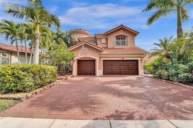 mediterranean / spanish-style home featuring a garage