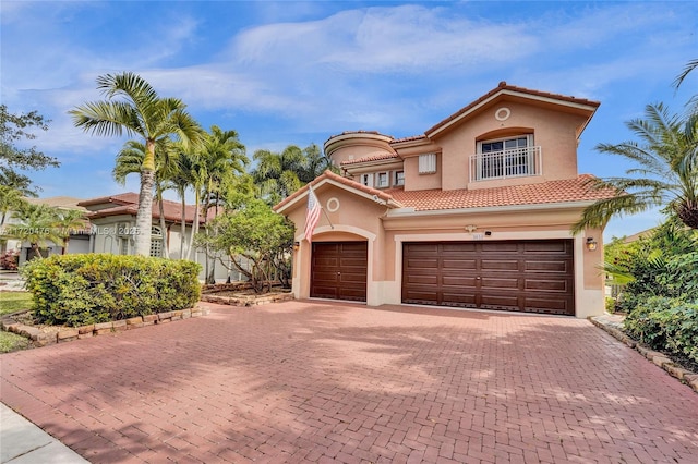 mediterranean / spanish-style house featuring a garage