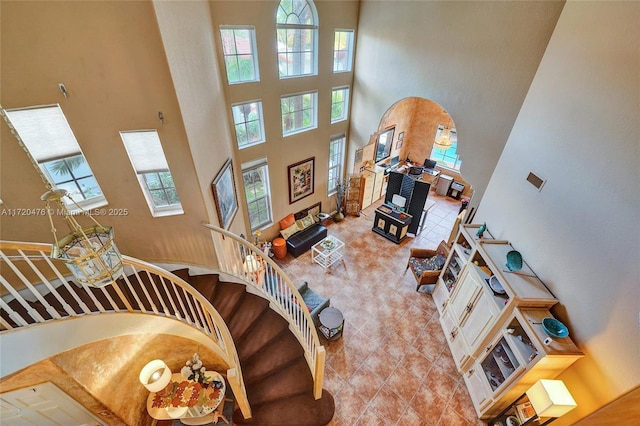 living room with a high ceiling