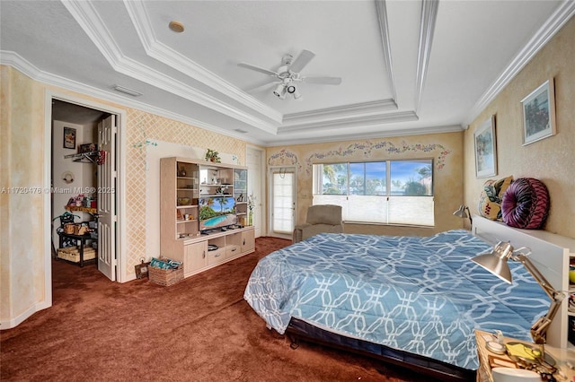 carpeted bedroom with a raised ceiling, ceiling fan, and ornamental molding