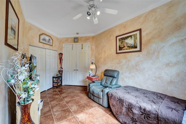 sitting room with ceiling fan, ornamental molding, and tile patterned floors