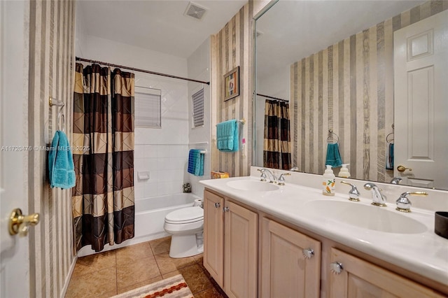 full bathroom featuring toilet, tile patterned flooring, shower / bath combo, and vanity