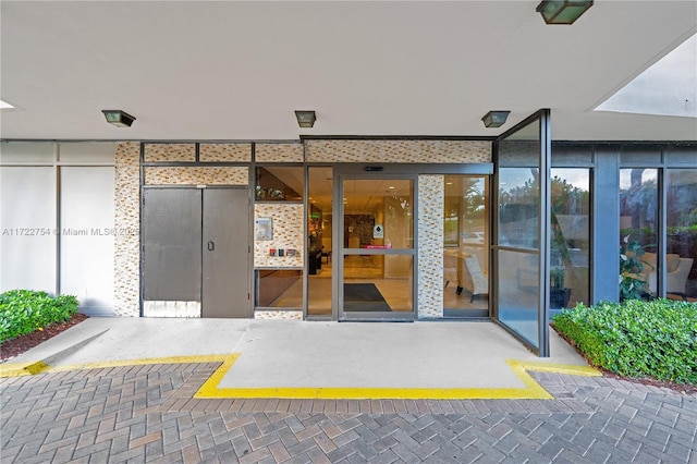 doorway to property with a patio