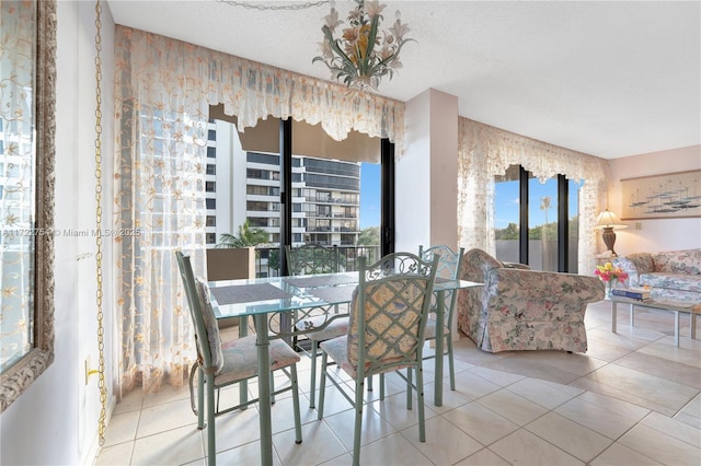 tiled dining space with a textured ceiling