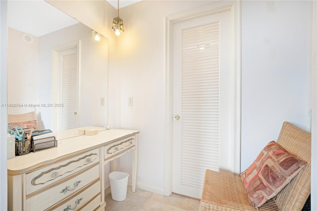 bathroom with tile patterned floors and vanity