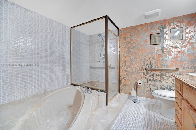 full bathroom with toilet, vanity, tile patterned floors, and independent shower and bath