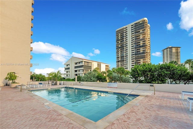 view of pool featuring a patio