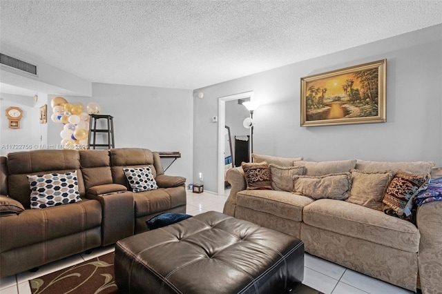 tiled living room with a textured ceiling