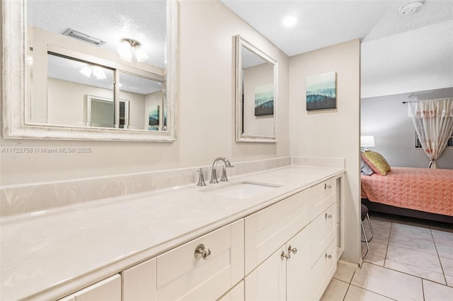 bathroom featuring vanity and a textured ceiling