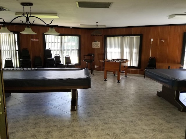 playroom with billiards and wooden walls