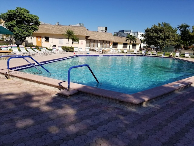 view of swimming pool with a patio area