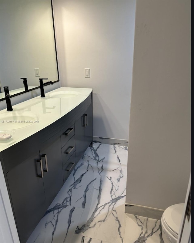 bathroom with vanity and toilet