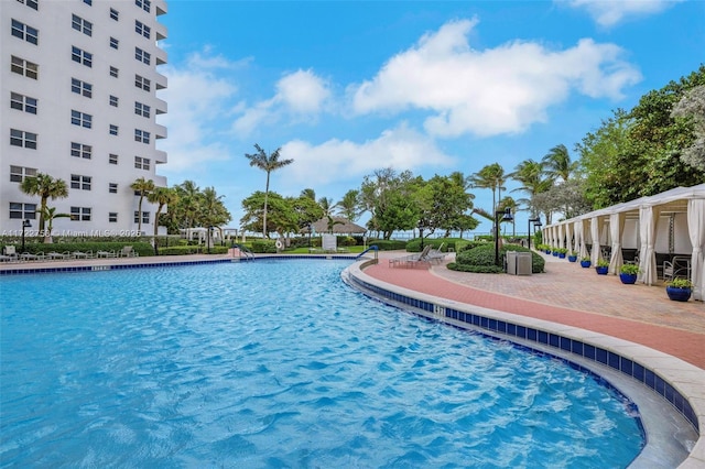 community pool with a patio area