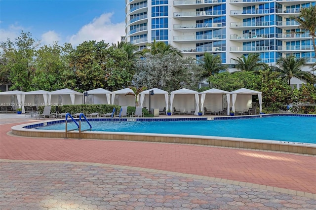 community pool with a patio area