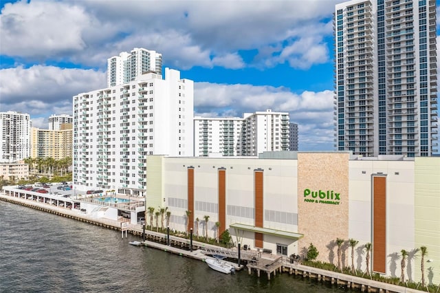 view of building exterior with a view of city and a water view