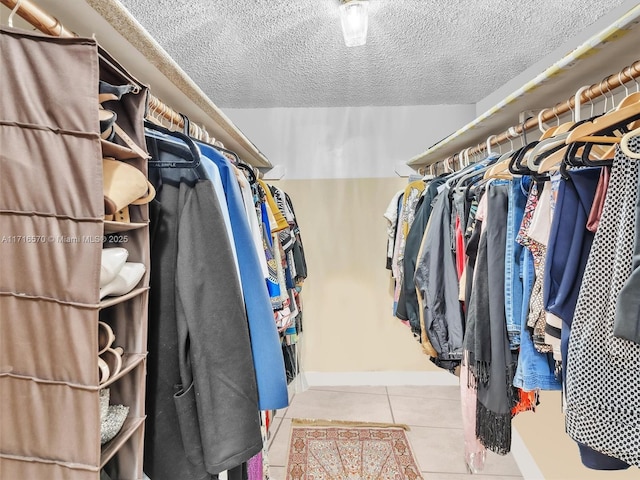 walk in closet featuring light tile patterned floors