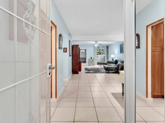 hallway featuring light tile patterned floors