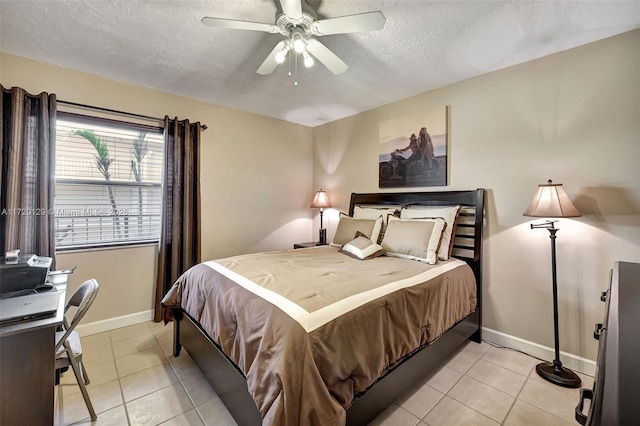 bedroom with ceiling fan and light tile patterned flooring