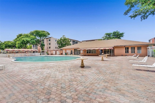 view of swimming pool featuring a patio area