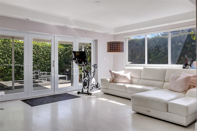 unfurnished living room featuring french doors