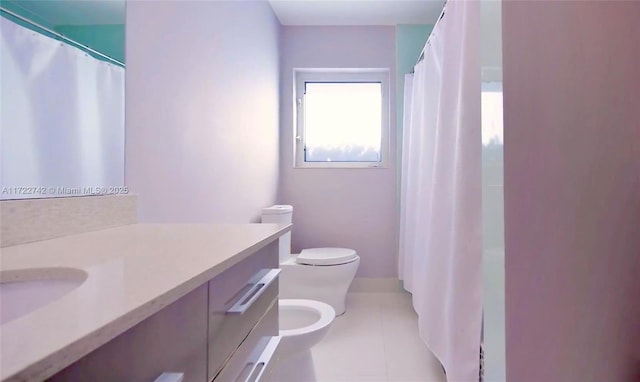 bathroom with a bidet, tile patterned flooring, vanity, and toilet