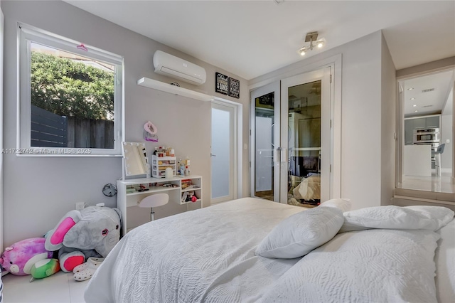 bedroom with a wall mounted air conditioner