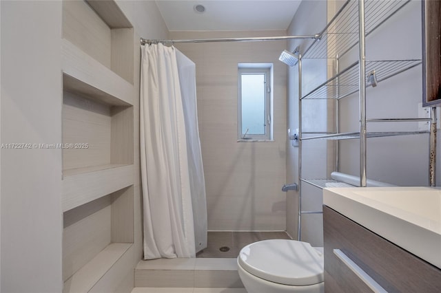 bathroom featuring toilet, vanity, tile patterned floors, and walk in shower