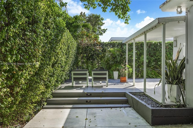 wooden deck with a patio