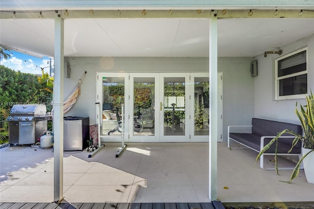 view of patio featuring french doors, area for grilling, and outdoor lounge area