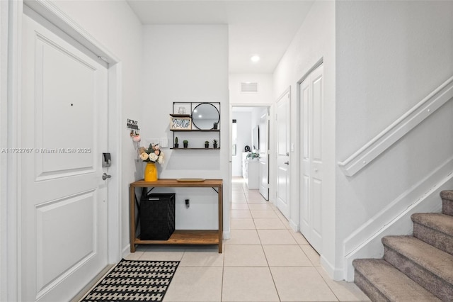 hallway with light tile patterned floors