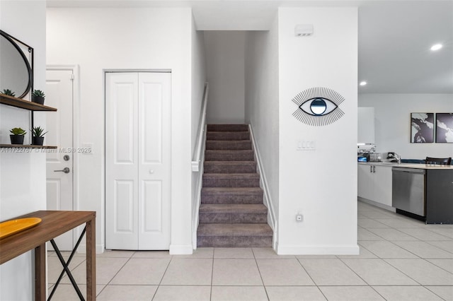 stairway featuring tile patterned floors