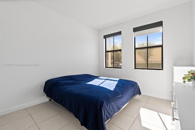 bedroom featuring light tile patterned floors