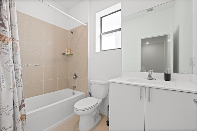 full bathroom featuring tile patterned flooring, vanity, toilet, and shower / tub combo with curtain