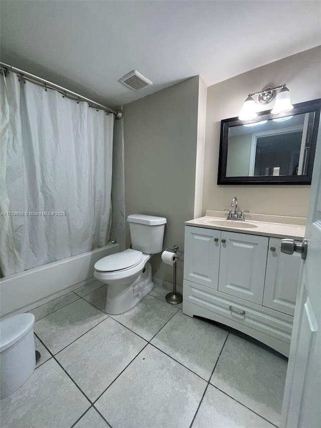 full bathroom with tile patterned floors, vanity, toilet, and shower / tub combo with curtain