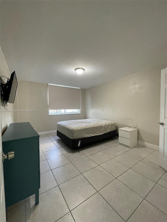 bedroom with light tile patterned flooring