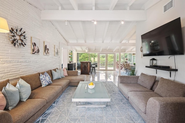 living room with high vaulted ceiling, beamed ceiling, and rail lighting