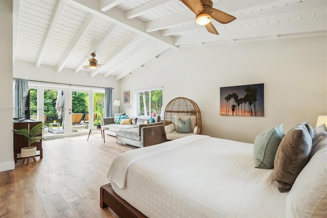 bedroom with ceiling fan, hardwood / wood-style floors, access to outside, vaulted ceiling with beams, and french doors