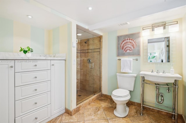 bathroom featuring toilet, sink, and walk in shower