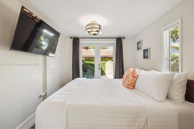 bedroom with access to exterior and french doors