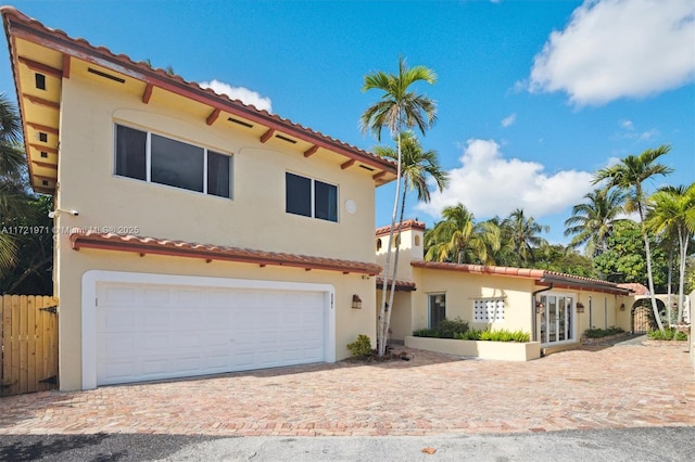 mediterranean / spanish-style home featuring a garage