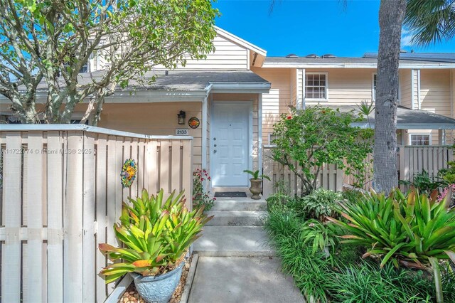 property entrance with fence