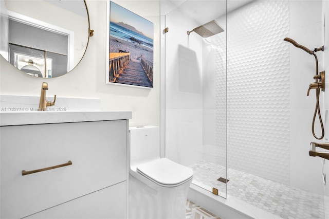 bathroom with vanity, toilet, and a shower