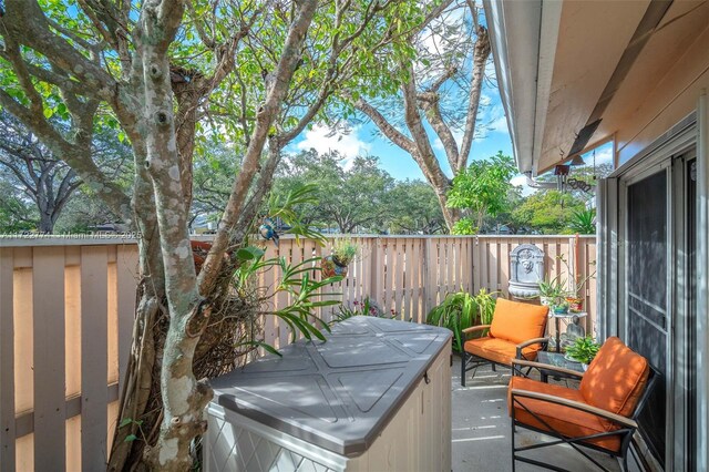 view of patio with a hot tub