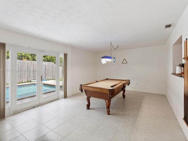 recreation room with french doors, light tile patterned floors, and pool table