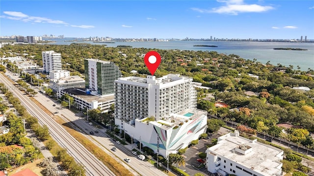 birds eye view of property with a water view