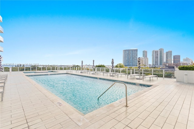 view of swimming pool featuring a patio