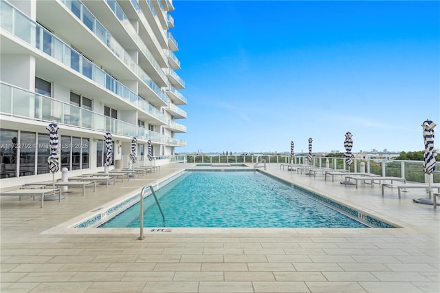 view of pool featuring a patio area