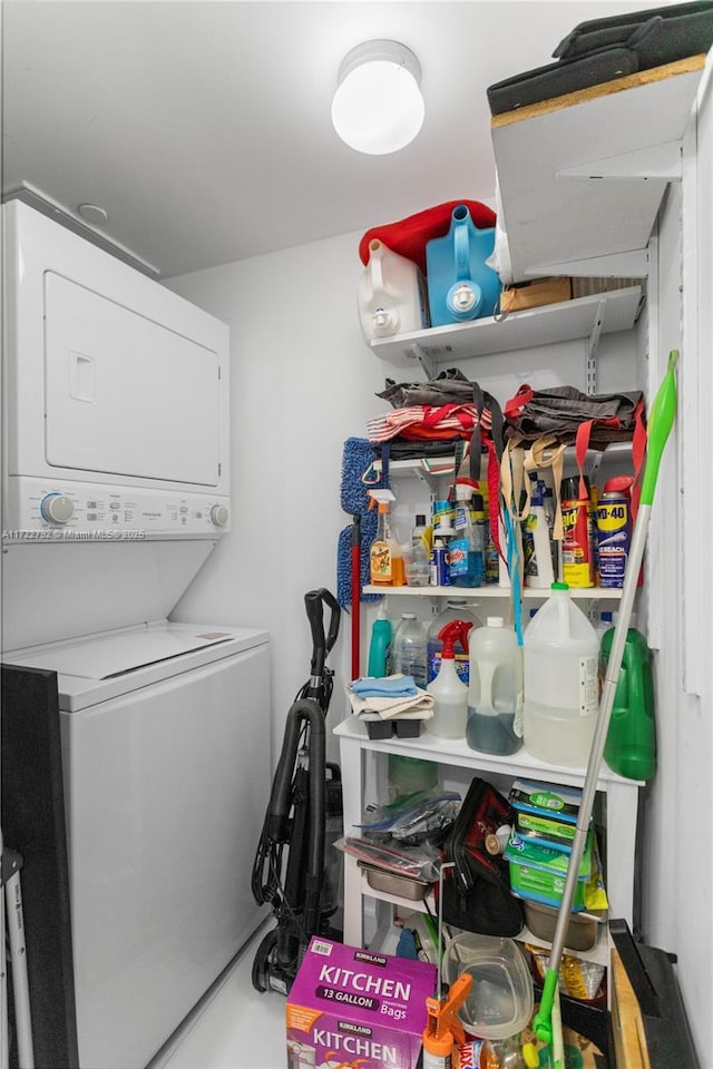 washroom with stacked washer / dryer