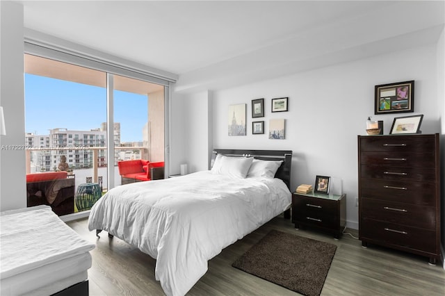 bedroom with hardwood / wood-style flooring